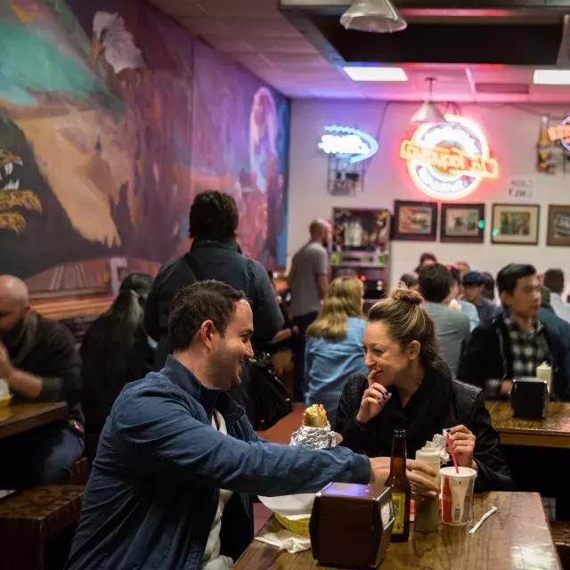 Visitors enjoy authentic Mexican food in San Francisco's Mission neighborhood.